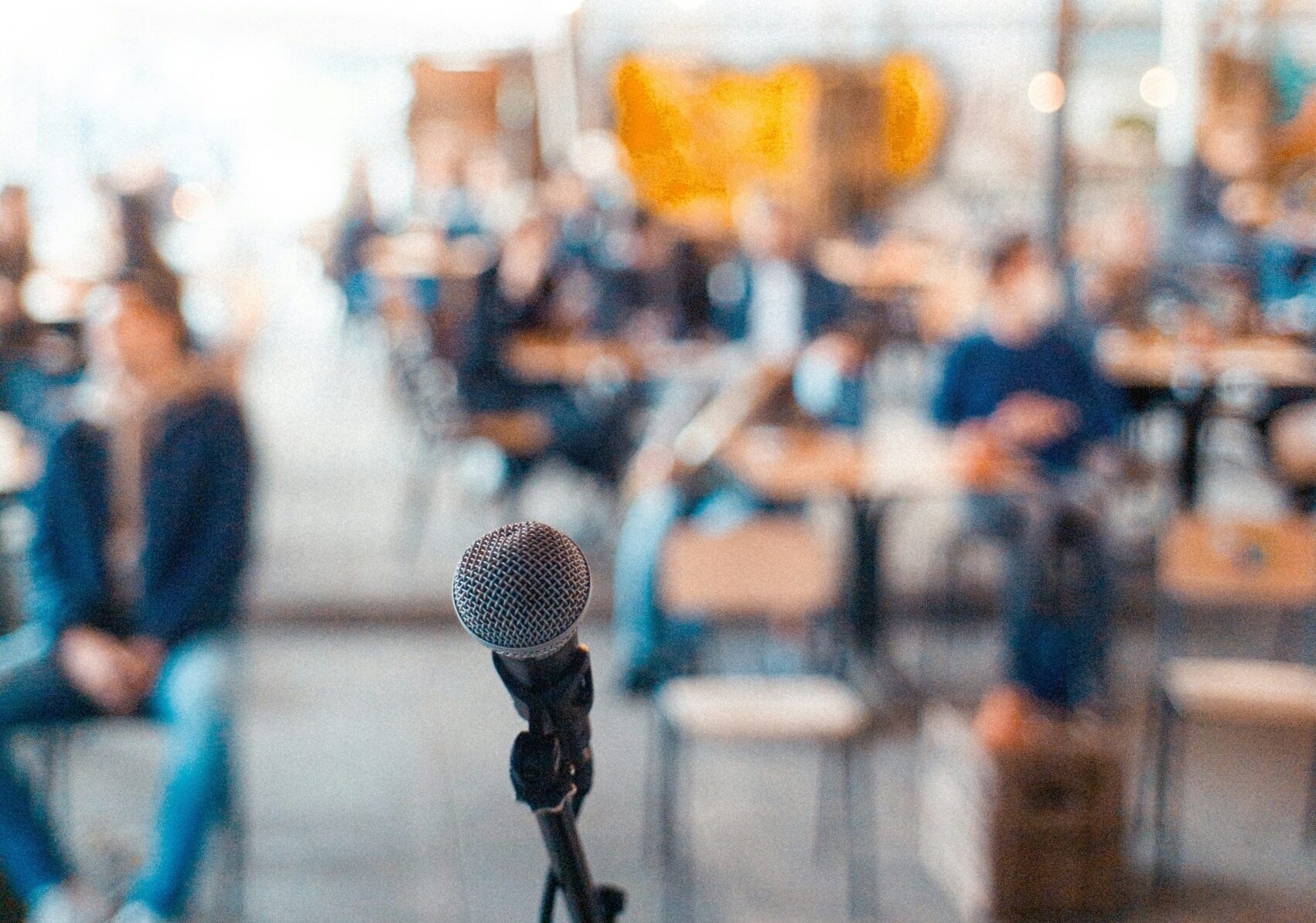 john-tuesday-c7uJzCBbjnM-unsplash Microphone on stage